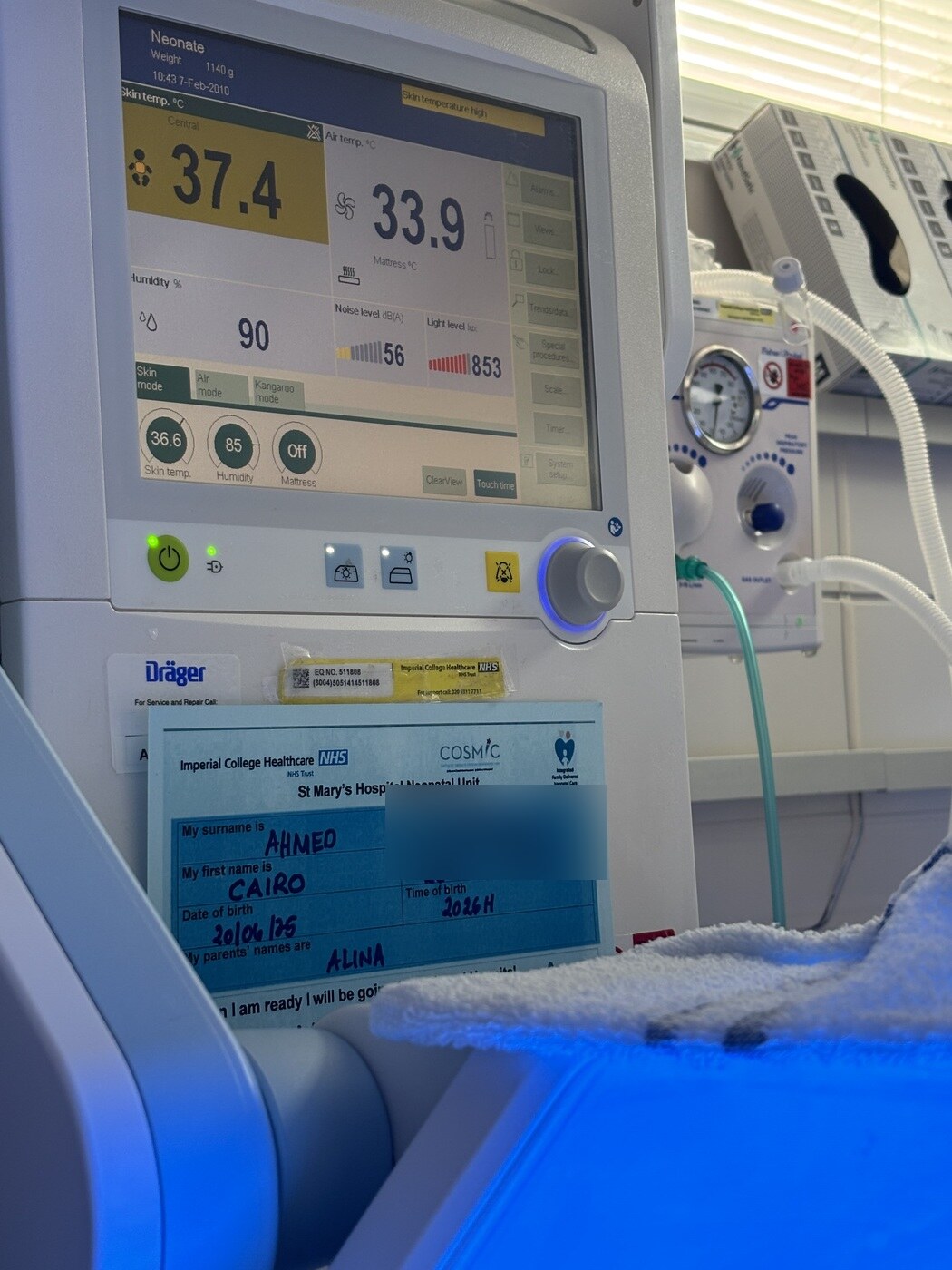 Kairo's NICU cot with the hospital number blurred